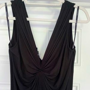 Deep v-neck dress with gathering in the front.